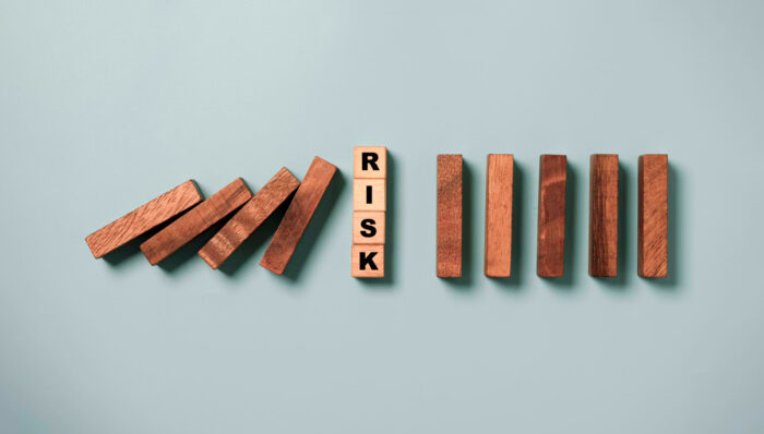 top-view-risk-wording-wooden-cube-block-stop-wooden-falling-domino-risk-analysis-assessment-management-concept